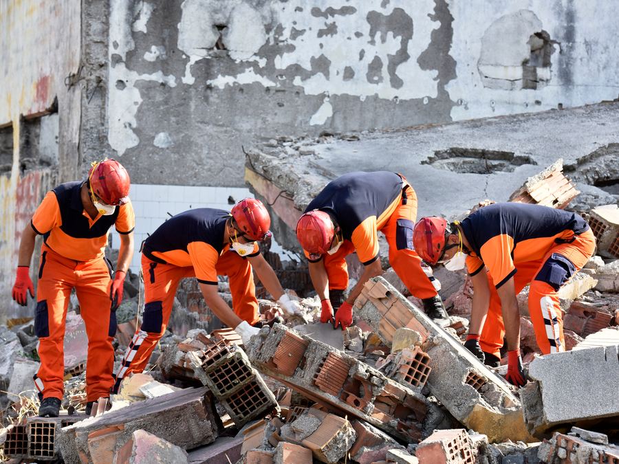 Rescue team working in the rubble of a collapsed building